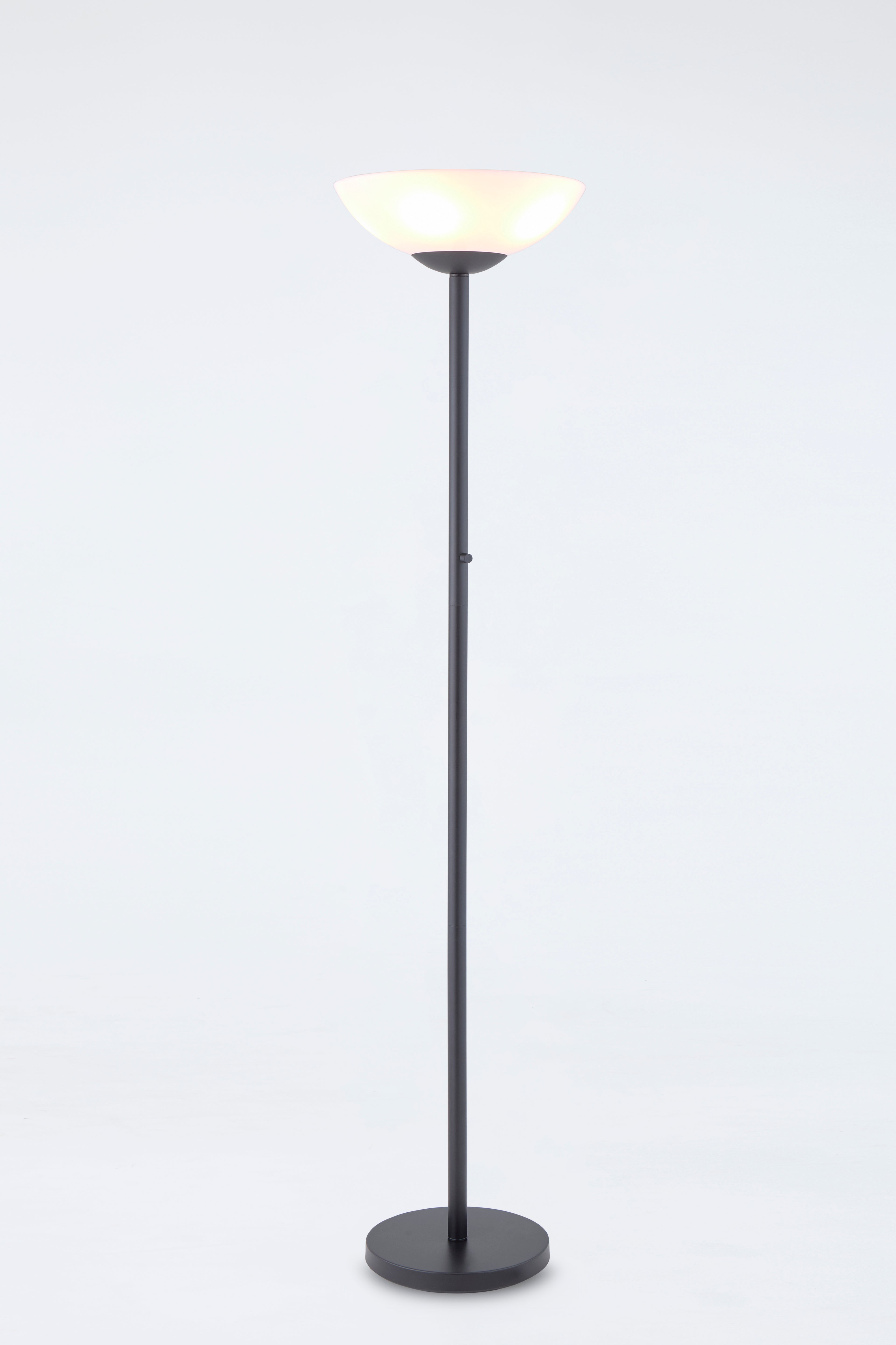Floor lamp with a black base and white shade on a light gray background